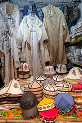 Wall Mural - Stall selling traditional clothing in the Osh Bazaar in Bishkek, Kyrgyzstan.