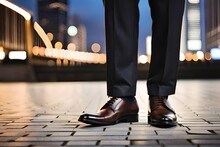 Pair Of Male Legs With Brown Dress Shoes And Dress Pants On An Urban Background