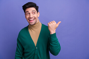 Canvas Print - Photo of cheerful nice man wear green trendy clothes recommend buy brand product look empty space isolated on purple color background