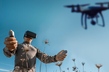 Modern technology in the army. Warfare operator using virtual reality glasses, vr controller. Pilot of aerial reconnaissance, surveillance and targeted attacks for military team and troops outdoors