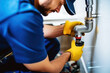 Plumber working in the bathroom, plumbing repair service, assembling and install concept.