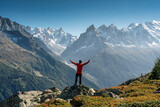 Fototapeta Fototapety góry  - A male hiker standing with enjoying the Mont Blanc mountain range view during trail in Lac Blanc at France
