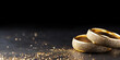 Golden wedding rings on a black  background 