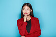 © PaeGAG - Pretty girl makes a thoughtful expression, Portrait of a beautiful young woman in a light blue background, happy and smile, posting in stand position.