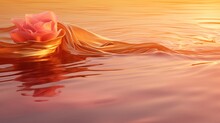  A Pink Flower Floating On Top Of A Body Of Water With A Sunset In The Backgroound Of It.