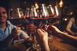 young hands toasting with wine glasses