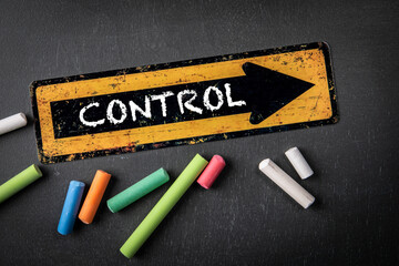 Wall Mural - CONTROL Concept. Direction arrow with text on a dark chalkboard background