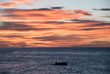 Wall Mural - Cloudy dawn next to the Aguilas lighthouse on the Spanish coast.