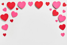 Romantic Composition With Red And Pink Paper Hearts On White Background. St. Valentine's Day.