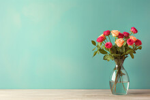 Bouquet Of Red Roses In Vase On Turquoise Background