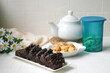 Chocolate moist cake with nuts and cornflakes cookies.
