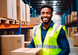 © Anton Dios - Portrait of smiling african american male warehouse worker holding box in warehouse. This is a freight transportation and distribution warehouse. Industrial and industrial workers concept