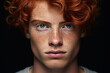 © Margo Alexa - Portrait of a red-haired young man on a black background. close-up, detailed portrait