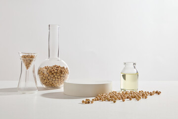 Wall Mural - A podium in round shaped displayed with some laboratory glassware containing soybeans and soybean oil. Soybean (Glycine max) can help reduce the appearance of wrinkles