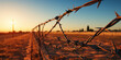 © vectorizer88 - The imposing presence of a barbed wire fence, symbolizing protection