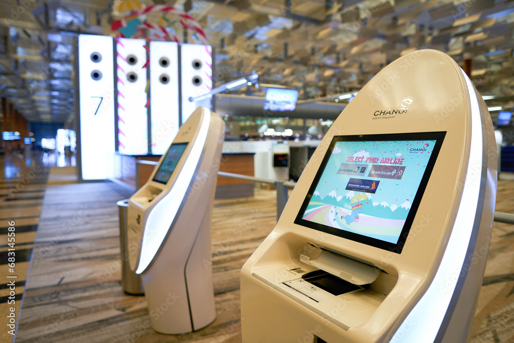 SINGAPORE - NOVEMBER 06, 2023: self check-in kiosks in Singapore Changi ...