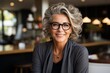 Smiling woman in glasses in cafe