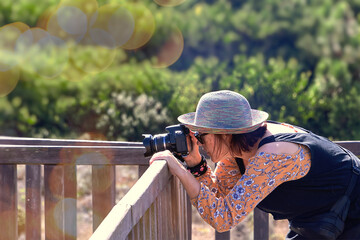 Woman taking a photo with camera