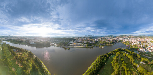 Wall Mural - Aerial panorama view of Sunflower Building at Lam Vien Square in Da Lat City. Tourist city in developed Vietnam. Center Square of Da Lat city with Xuan Huong lake