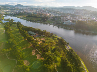 Wall Mural - Aerial panorama view of Sunflower Building at Lam Vien Square in Da Lat City. Tourist city in developed Vietnam. Center Square of Da Lat city with Xuan Huong lake