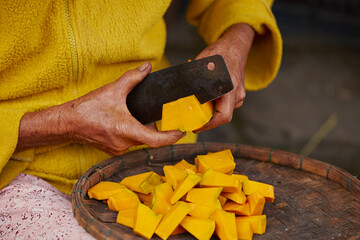 Canvas Print - Hand cutting pumpkin with a knife