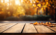 The empty wooden table top with blur background of autumn