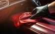 Inside car cleaning, Wax on red seat, Inside luxury car, micro fiber cleaned, black glove.