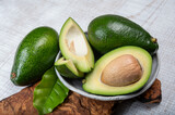 Fototapeta  - Green ripe avocado fruits from organic avocado plantation - healthy food