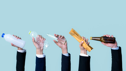 Businessman's hand holding garbage waste on isolated background. Eco-business recycle waste policy in corporate responsibility. Reuse, reduce and recycle for sustainability environment. Quaint