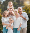 Portrait of big family in backyard together with smile, grandparents and parents with kids in park. Nature, happiness and men, women and children in garden with love, support and outdoor bonding.