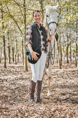 Poster - Portrait of happy woman with horse standing in forest, nature and love for animals, pets or dressage with trees. Equestrian sport, jockey or rider in woods for adventure, pride and smile on face.