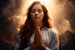 beautiful girl praying to god with heaven light