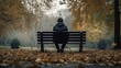 Lonely man sitting on bench