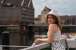 © Андрей Трубицын - girl in a white hat on the background of the city of Gdansk Poland Europe