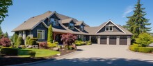 Elegant Design Of Luxury Home Exterior On Sunny Day With Blue Sky Includes Three Car Garage And Large Driveway