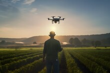 A Man In The Green Farm Fields Flying A Modern Tech Drone Monitoring Agriculture, Innovative Concept