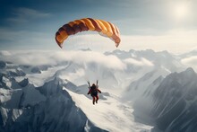 A Man With Parachute Skydiving At High Altitude In Sky In Snowy Mountains