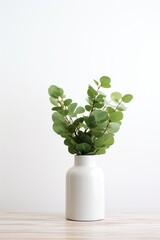 Aufkleber - A simple and elegant white vase filled with fresh green leaves. This versatile image can be used to enhance any home decor or floral-themed project