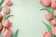 Frame of pastel colored paper tulip flowers, copy space in center