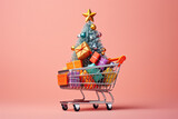 Fototapeta  - carro de la compra en miniatura conteniendo paquetes regalo y árbol de navidad con una estrella dorada sobre fondo rosa