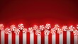  a row of red and white candy, candy cane, aligned against a gradient red background, creating a festive border.