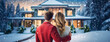 Young family couple stands in front of modern private country house during winter holidays. Husband and wife hug each other. Real estate, moving home or renting property concept.
