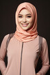 © grey - Portrait of a beautiful arab woman smiling, wearing hijab