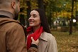 © New Africa - Romantic young couple spending time together in autumn park, space for text