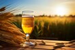 A perfect summer day with a glass of Saison beer on a rustic table in the countryside