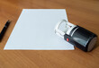 Sheet of paper pen and stamp dejat on the desk Corporate Document Template
