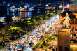 View of Me Linh roundabout with heavy traffic near Bach Dang waterbus station port and Saigon river at blue hour