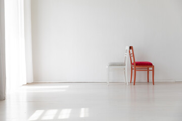 Canvas Print - Two vintage chairs in the interior of a white room