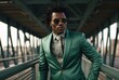 black man with a sunglass and a green suit standing on the bridge Afrofuturism green academia candid portraits