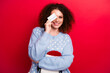 Photo of shy shiny lady wear ugly new year pullover credit card cover eye empty space isolated red color background